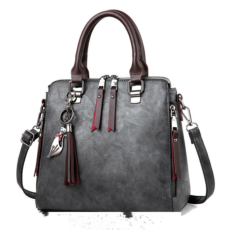 Vintage faux leather handbag with tassel