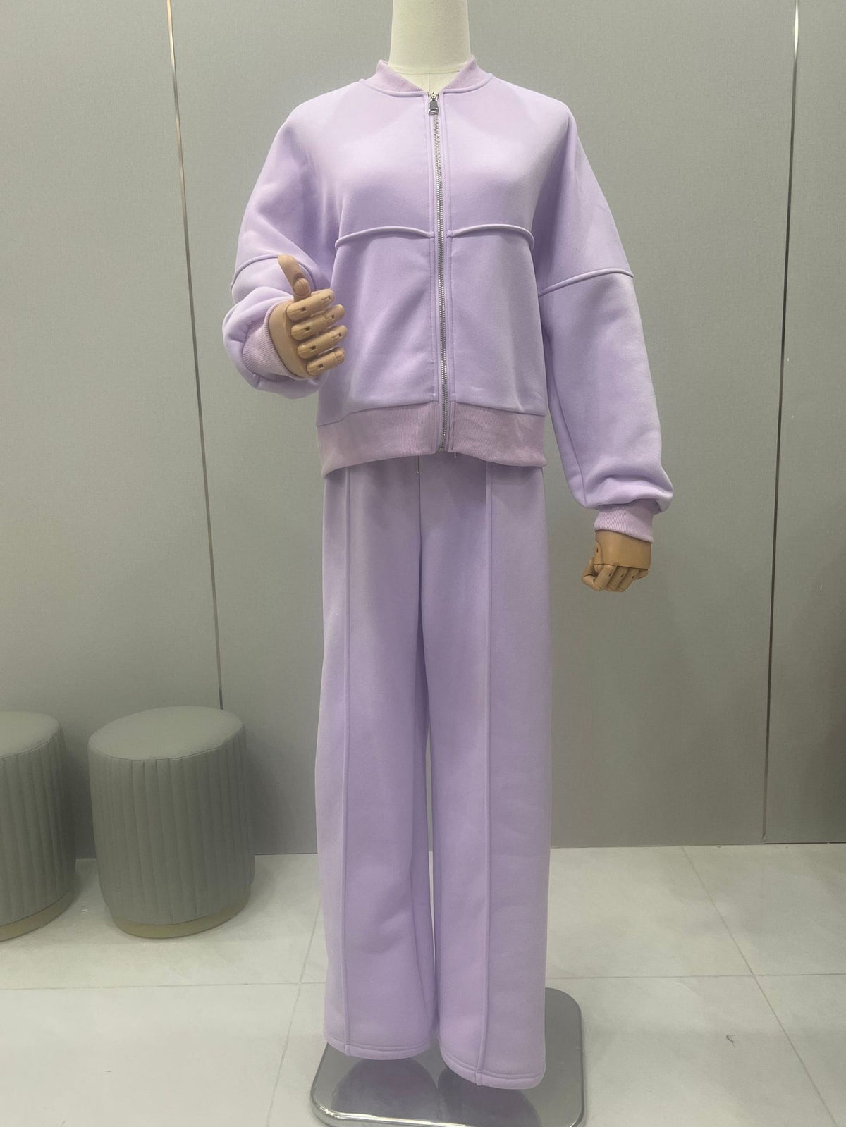 Woman in a zip jacket and wide-leg trousers set