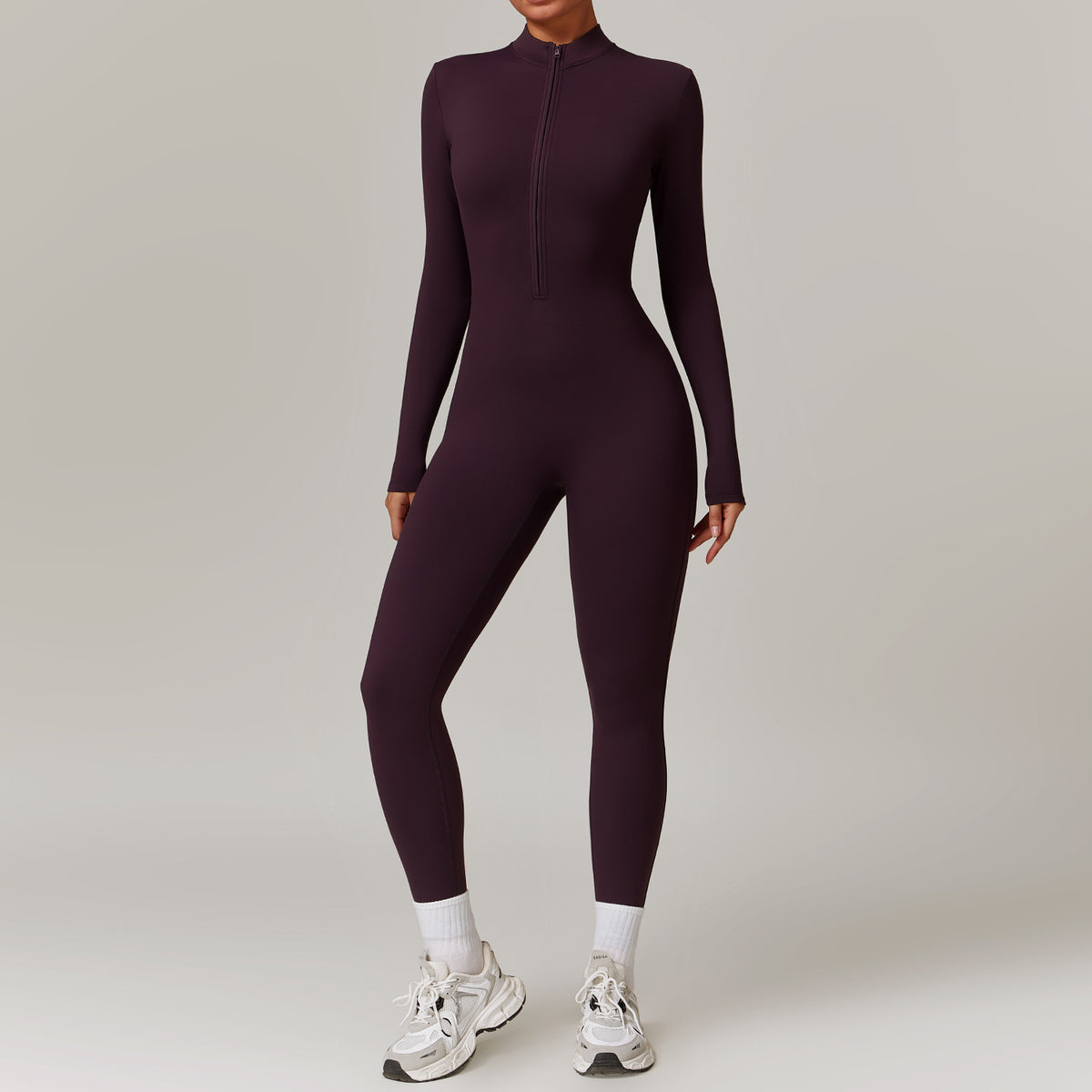 Woman in a zip-front yoga jumpsuit