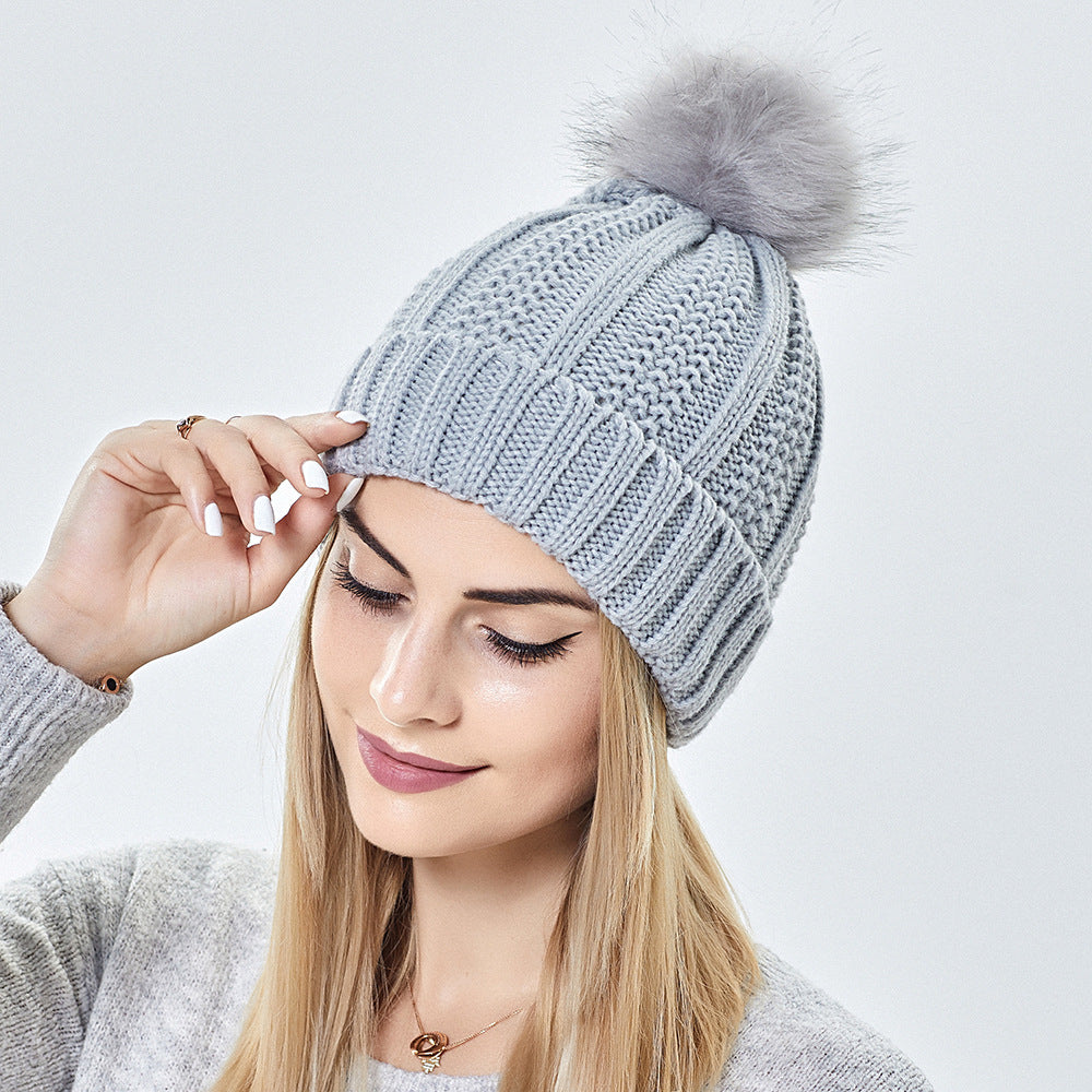 Chunky knit beanie with faux fur pom pom