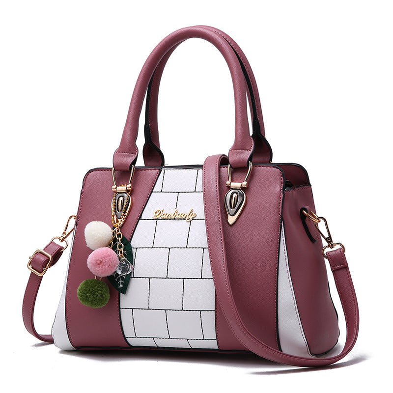 Two-tone handbag with pompom charm