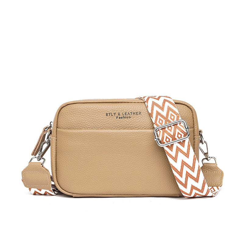 Small leather crossbody bag with patterned strap