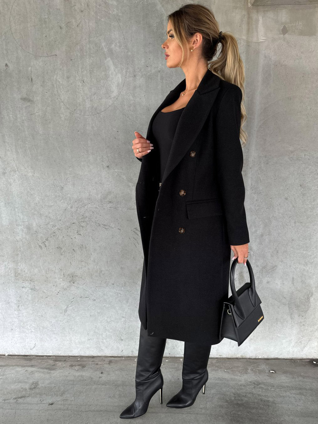Woman in long double-breasted coat