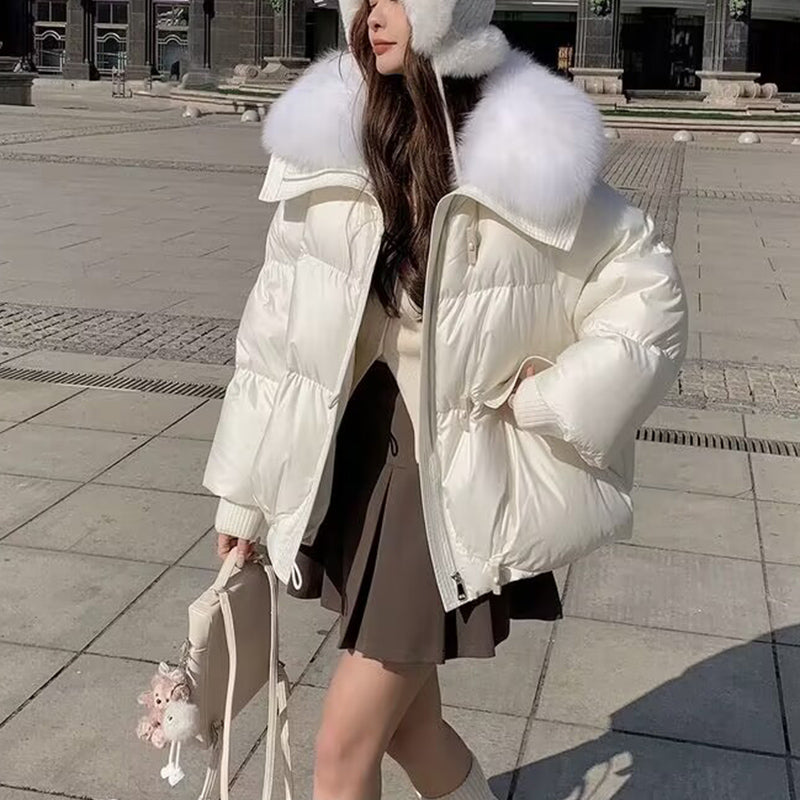 Woman in short puffer jacket with fur collar