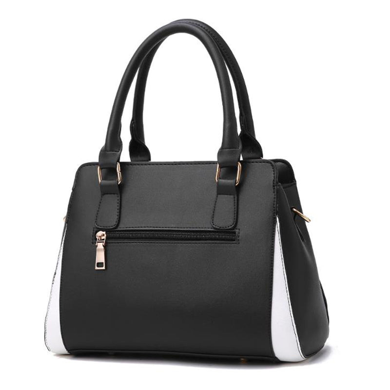Two-tone handbag with pompom charm