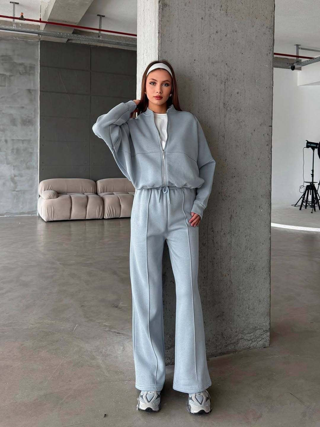 Woman in a zip jacket and wide-leg trousers set