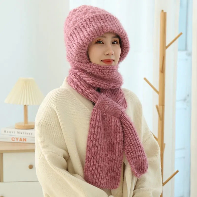 Woman wearing a knitted hood with attached scarf