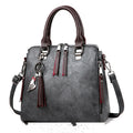 Vintage faux leather handbag with tassel