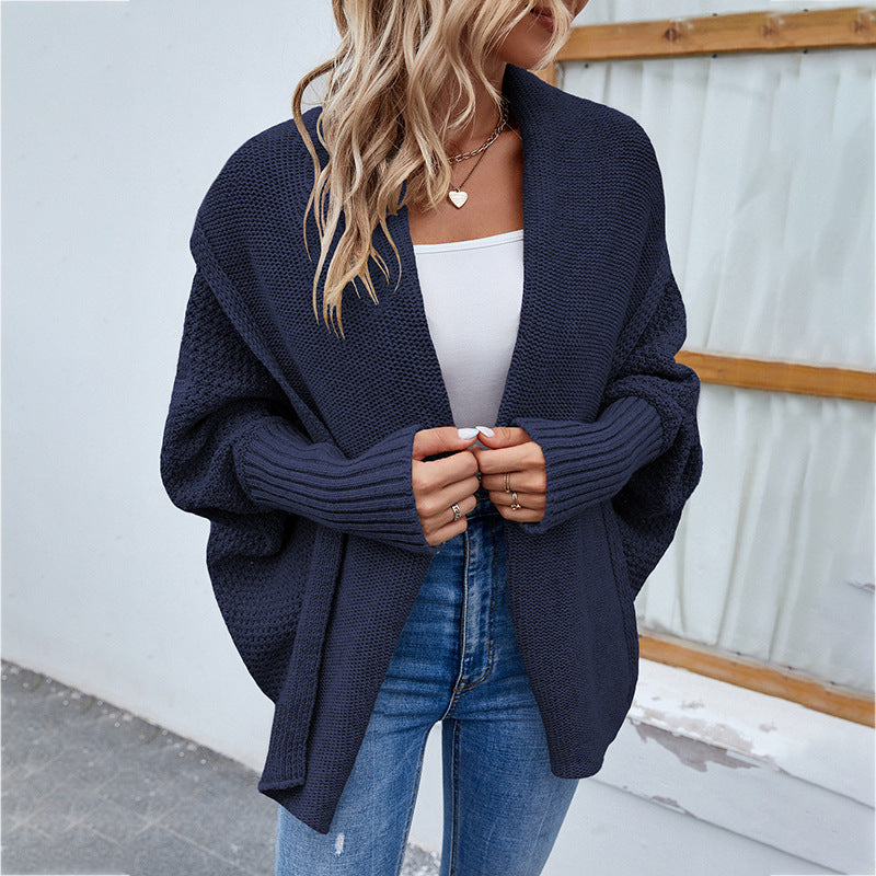 Woman in oversized chunky knit cardigan