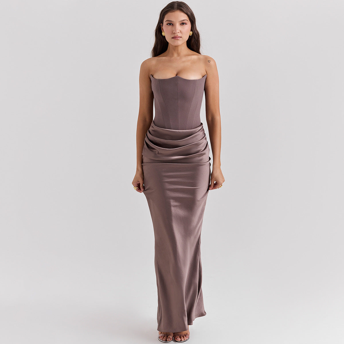 Woman in a strapless satin maxi dress