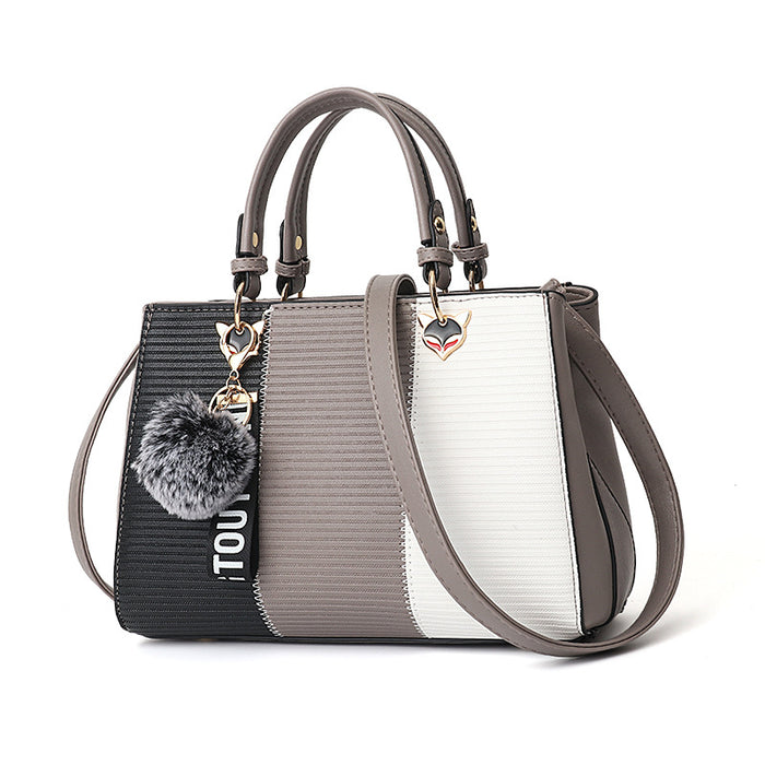 Poppy | Colour-block handbag with pompom charm