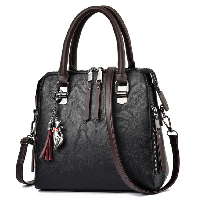 Vintage faux leather handbag with tassel