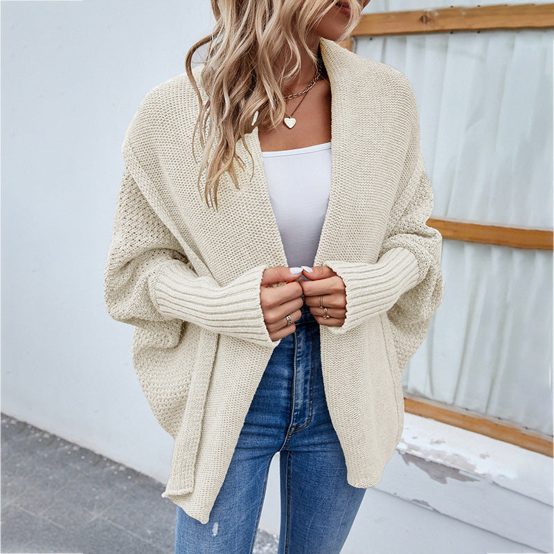 Woman in oversized chunky knit cardigan