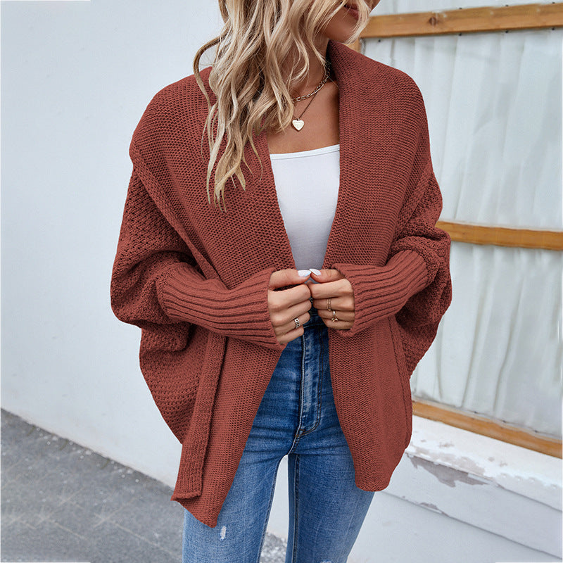 Woman in oversized chunky knit cardigan
