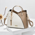 Colour block handbag with heart tassel