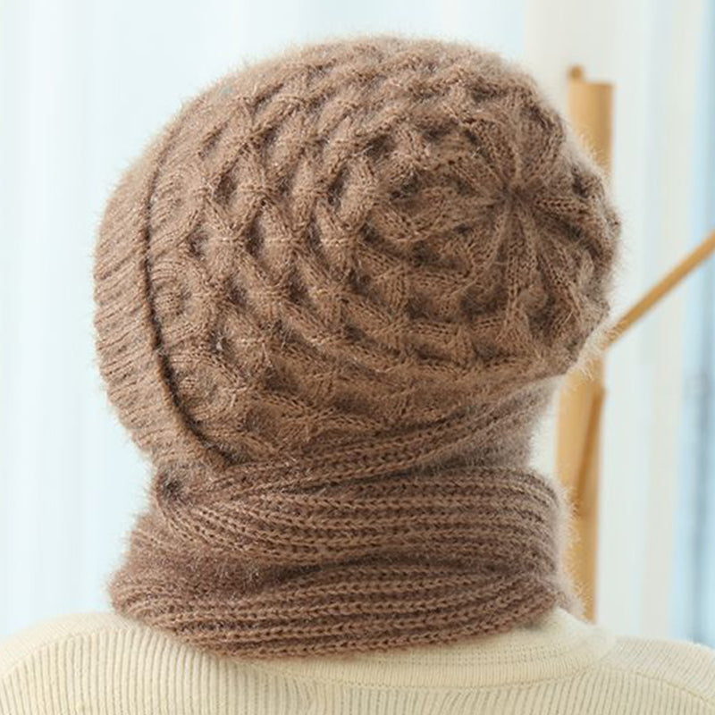 Woman wearing a knitted hood with attached scarf