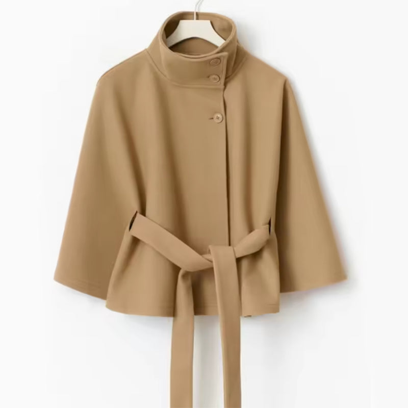 Woman in belted short cape coat