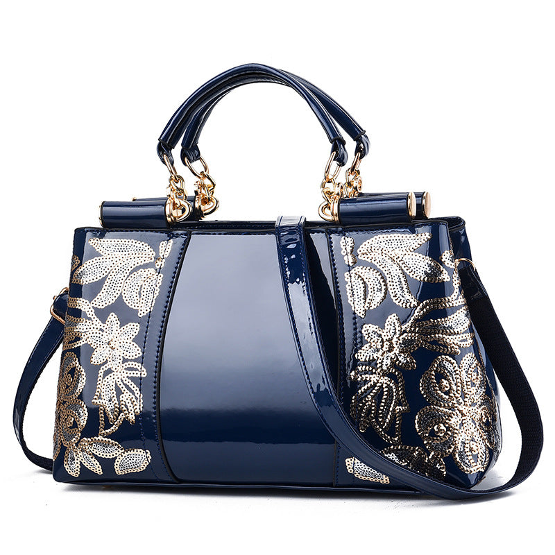 Sequin embroidered patent evening handbag