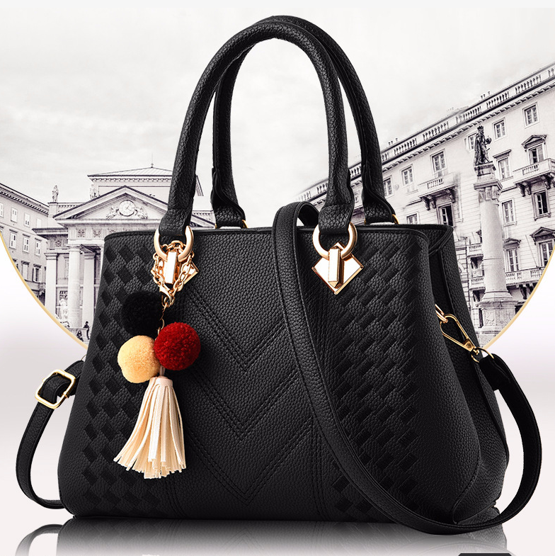 Embossed top handle handbag with pompom