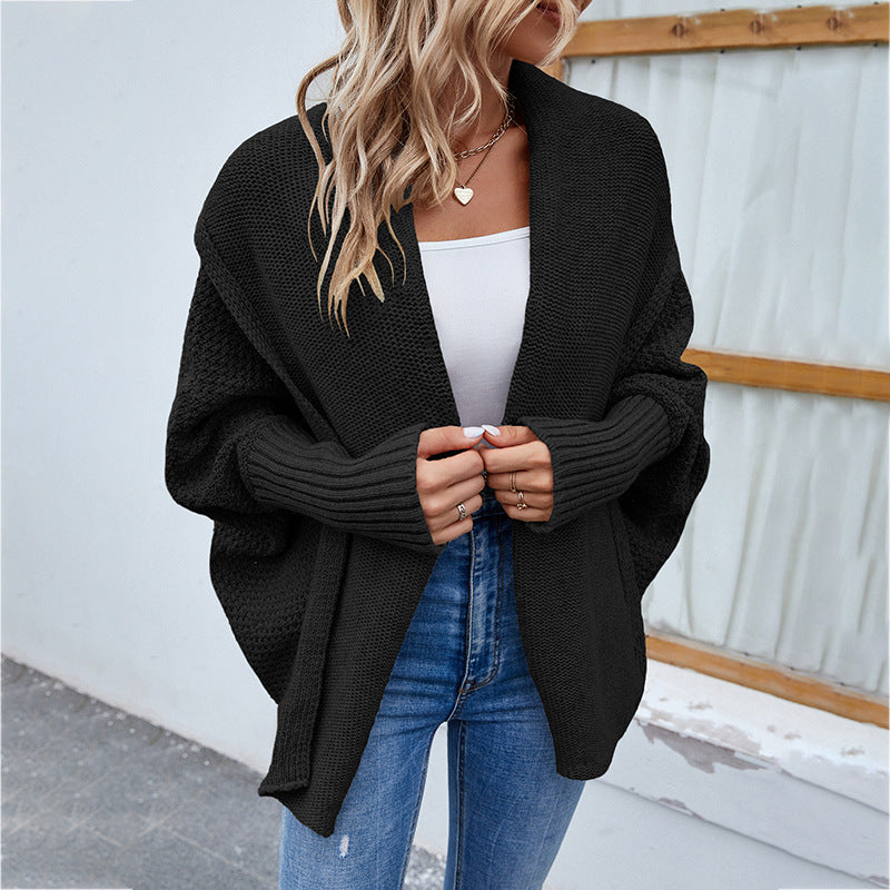Woman in oversized chunky knit cardigan